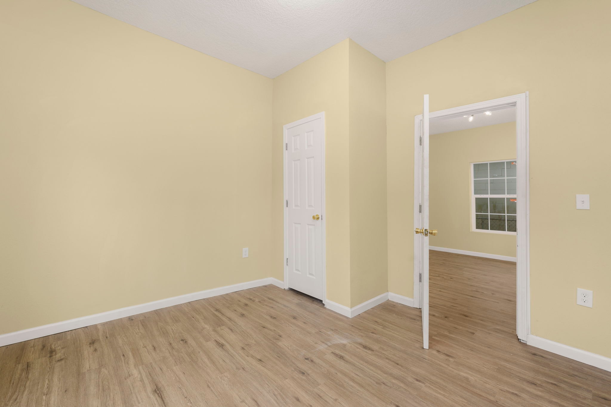 Interior room with white trim and multiple doorways